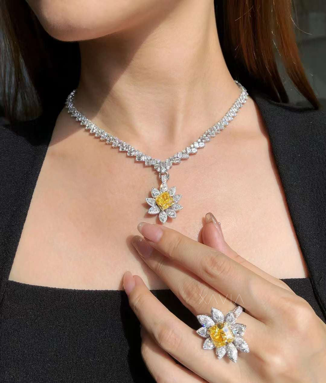 luxury diamond jewelry set featuring radiant yellow diamond floral halo ring and matching pendant necklace on model